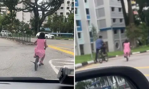 Young girl rides bicycle in middle of road at Toa Payoh, netizens slam her dad