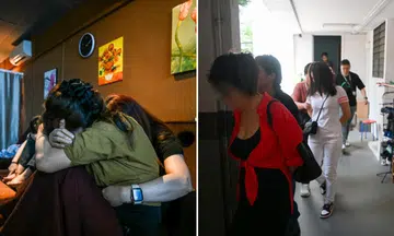 The Straits Times accompanied police officers during raids on massage parlours in Boon Lay (left) and Jurong West (right).