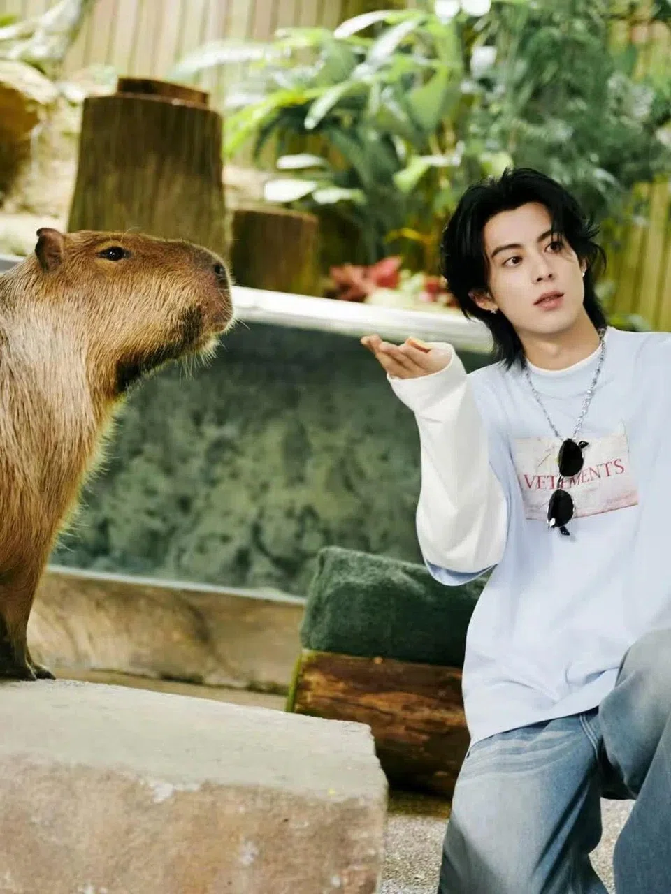 Chinese actor Dylan Wang with a capybara at River Wonders during his visit to Singapore in October. PHOTO: DYLAN_WANG_1220/INSTAGRAM