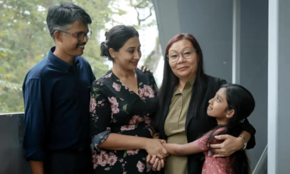 Domestic worker Rana Mamta (second from right) with her employers, Mr Joseph Harison and his wife Leens Joseph, and their daughter Serene Mary Harison. Photo: The Straits Times