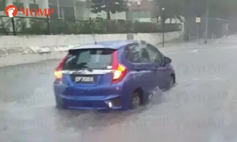 Honda gets stuck along Yio Chu Kang Rd during flash flood