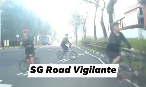 Cyclists riding against traffic give driver a shock at Woodlands Centre Road