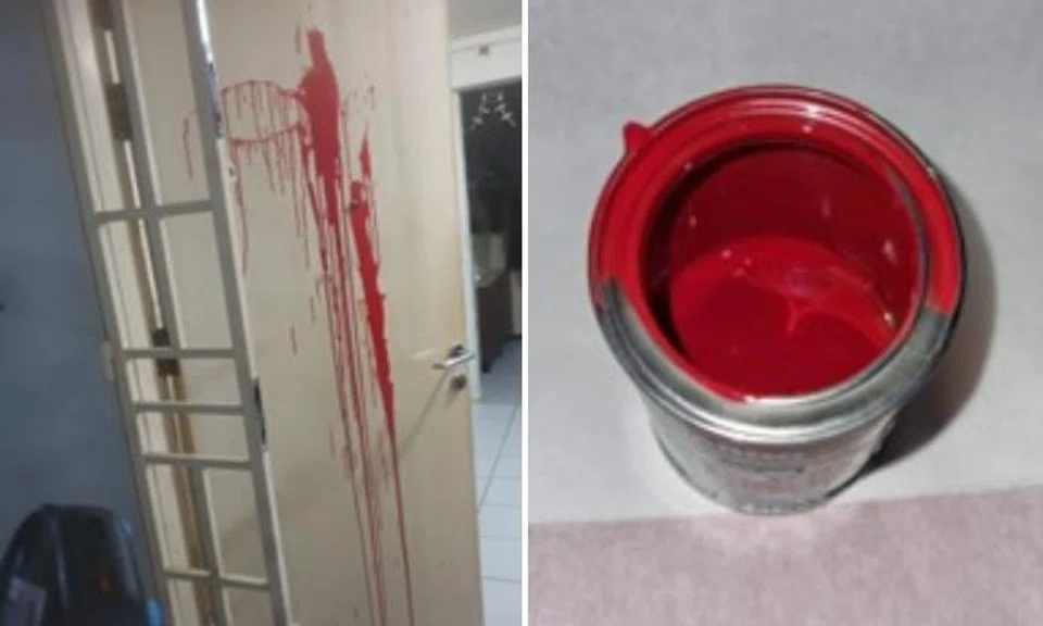 Main gate and door splashed with red paint.