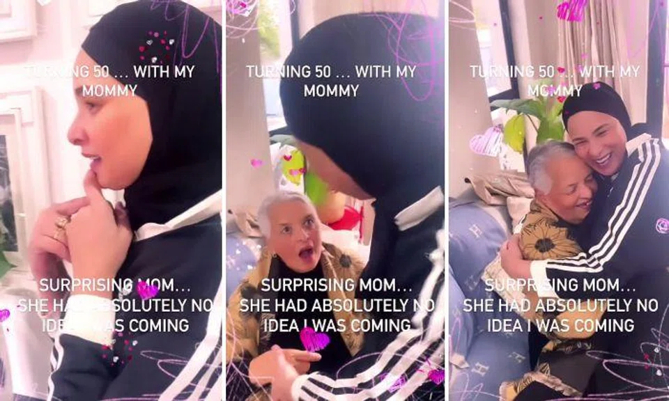 The heart-warming video shows Jacobs sneaking up to the older woman and smothering her with kisses.