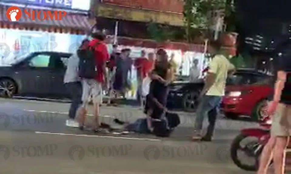 Man lies on road after accident with lorry in Geylang