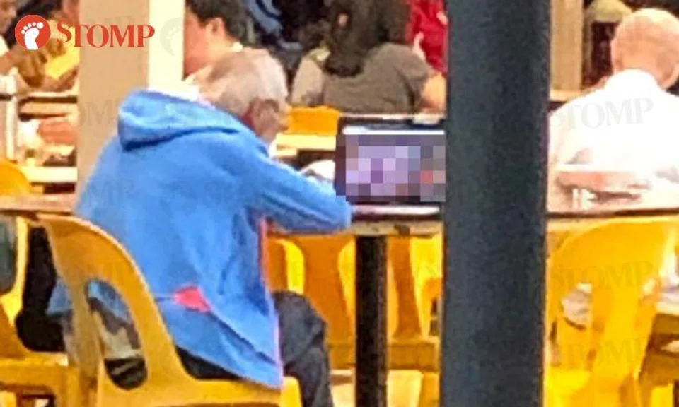 Uncle engrossed in watching obscene video on laptop at Marine Parade coffee shop
