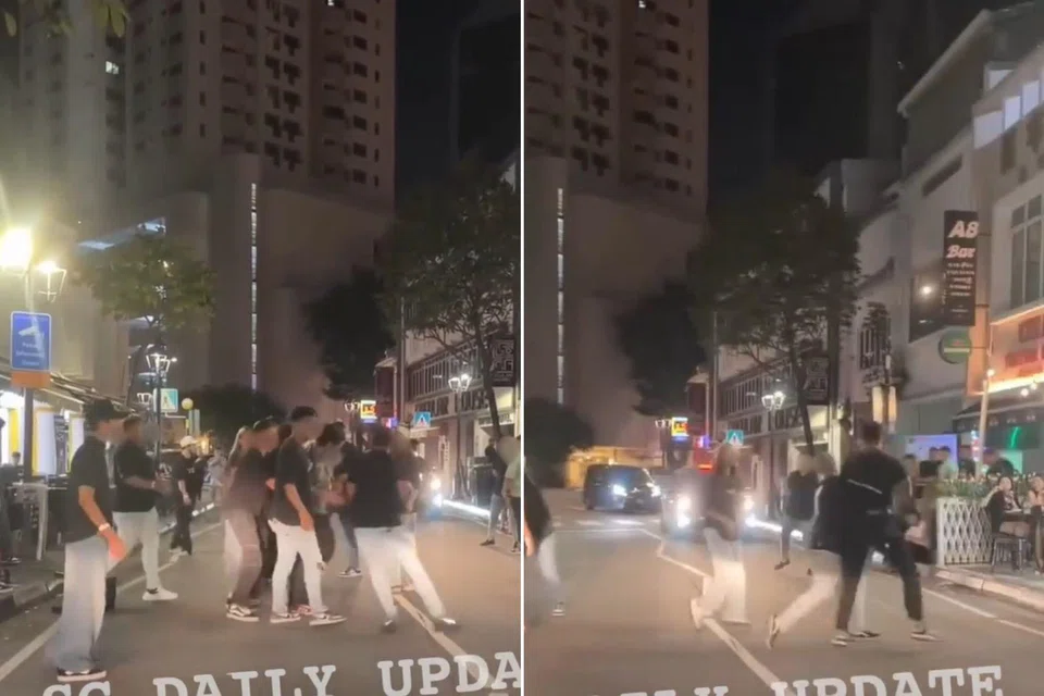 In a video which had gone viral online, more than 10 people are seen involved in an altercation on a street.