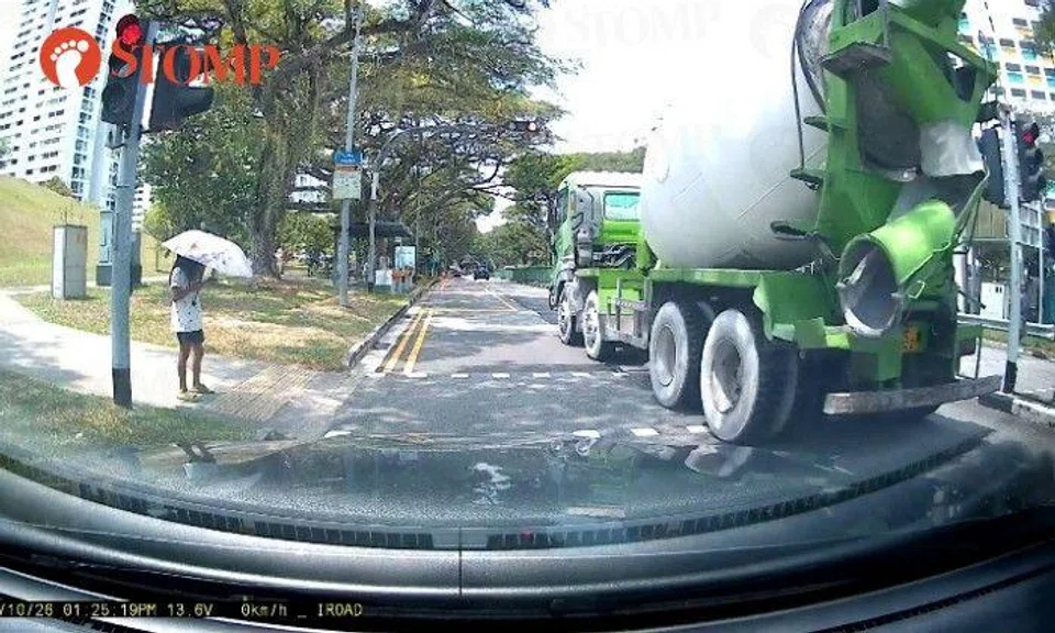 Saved by her phone? Cement truck could've hit distracted woman if she crossed road seconds earlier