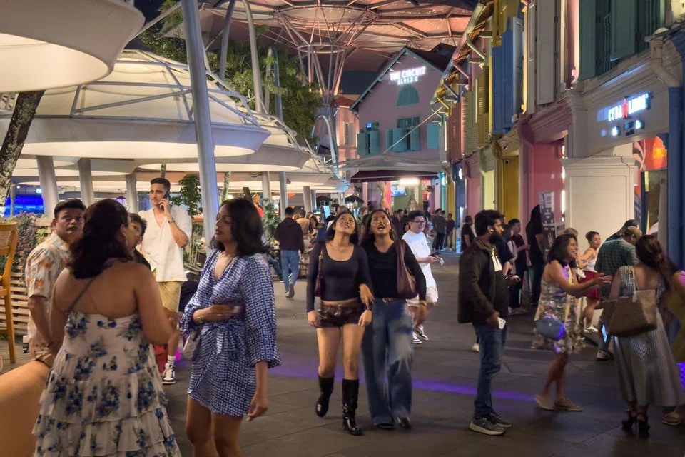 Patrons walking outside a pub in Clarke Quay on Aug 23.