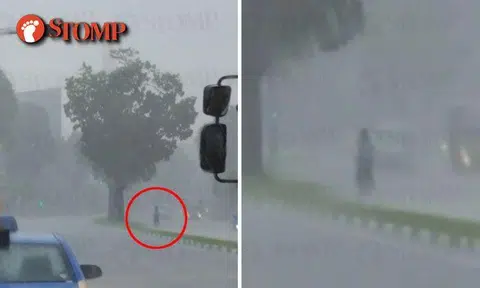 Driver snaps photo of building during downpour -- but what's that at the corner?