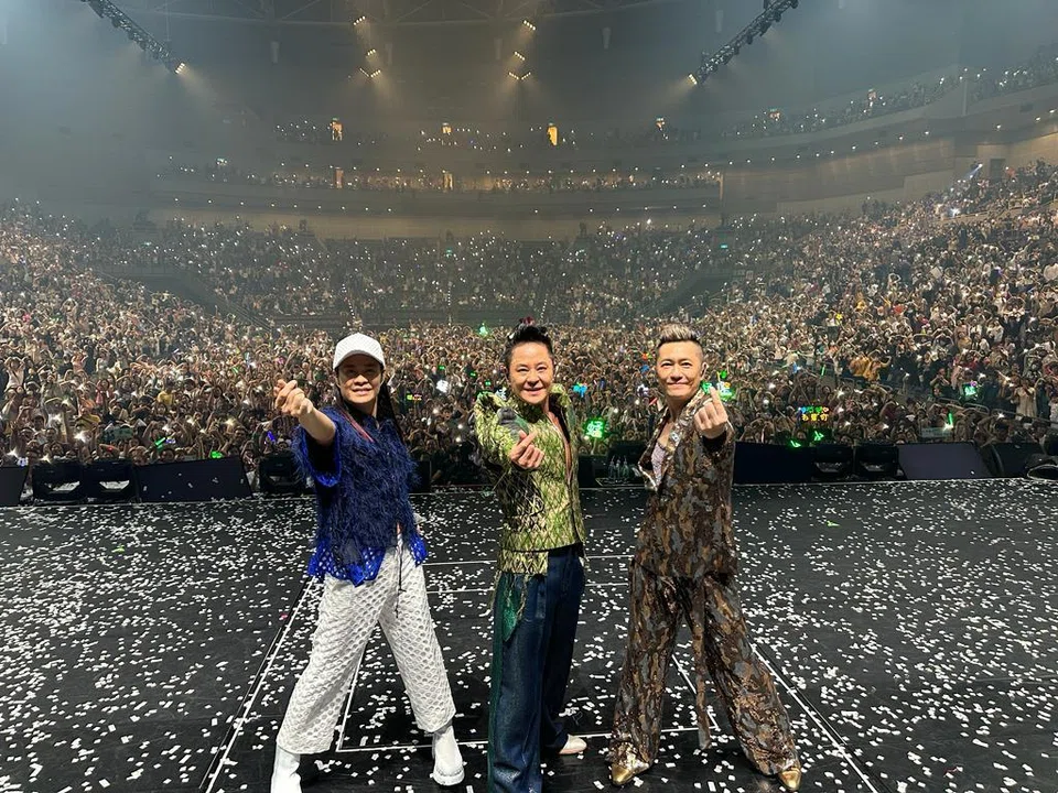 Hong Kong male group Grasshopper, comprising (from left) Calvin Choy, Remus Choy and Edmond So, during a concert in Kaohsiung in 2023.