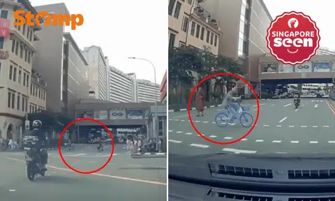 Pedestrian sprints across red light, cyclist follows suit in close calls caught on dashcam