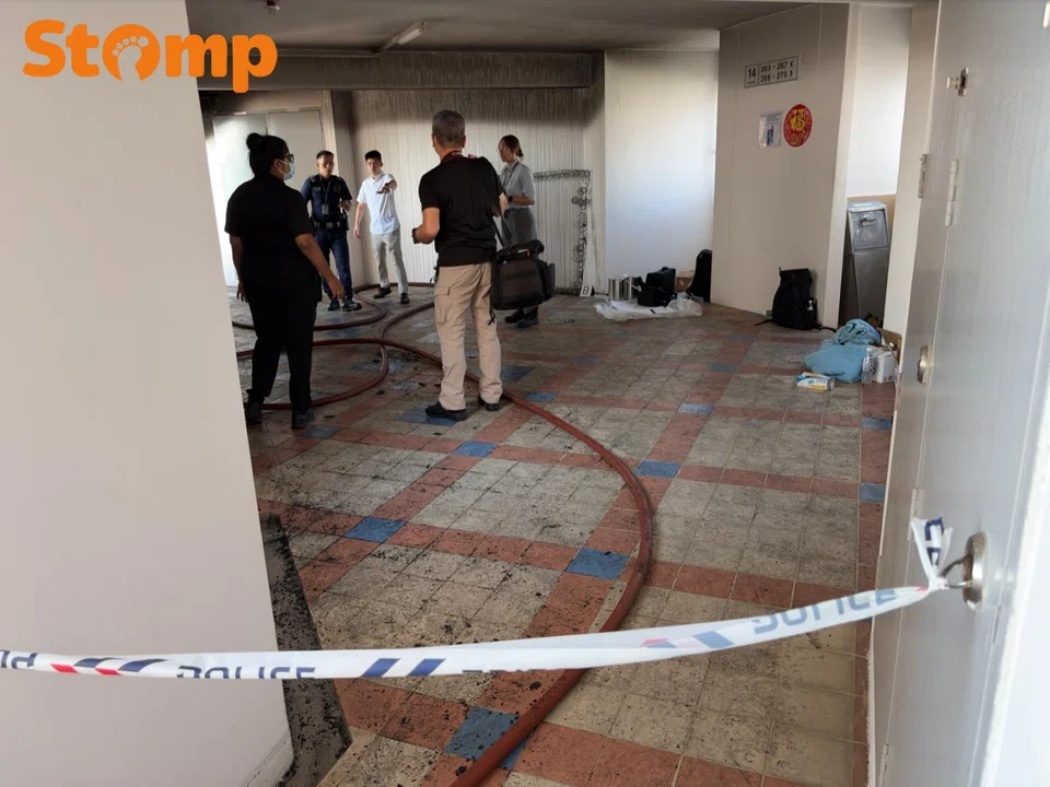 Police cordoned off the common area outside the unit. 