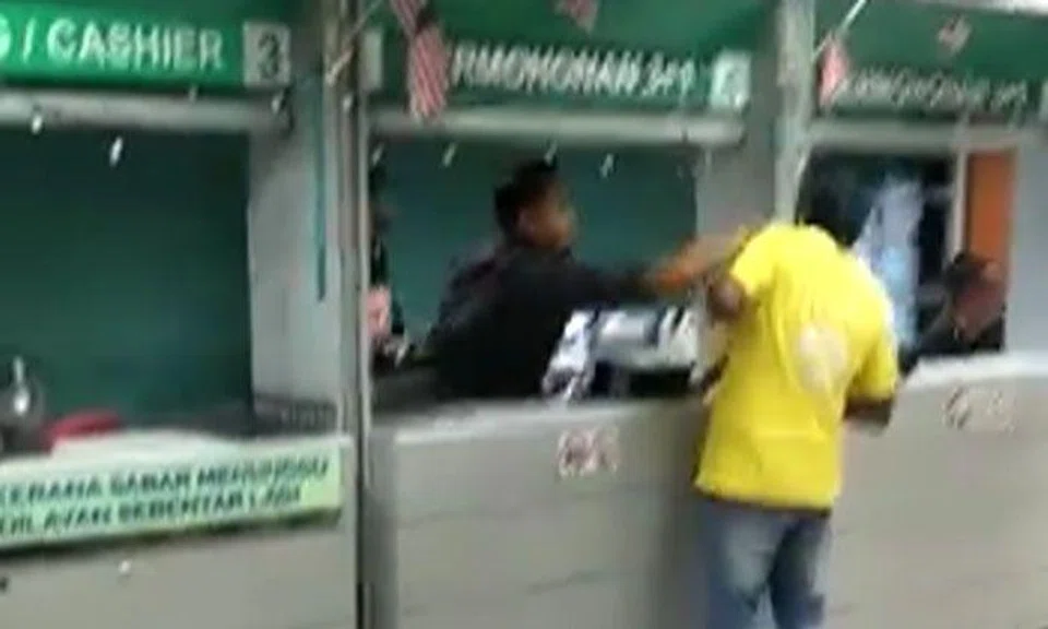 Malaysian immigration officer caught on camera assaulting foreigner