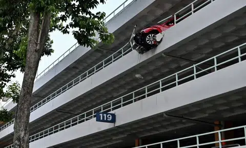 Volkswagen hangs 4 storeys above ground after crashing through wall at Bukit Merah carpark