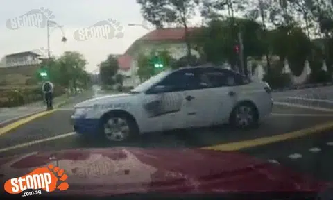 Why so impatient? Cabby beats red light and nearly causes accident