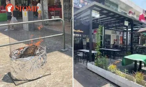 People were seen burning offerings outside a shop called Jane's Cake Station with the wind blowing the ashes towards the outdoor seating of two neighbouring restaurants, Lao Hero Kitchen and Spizza.