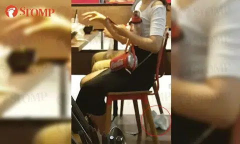 Why is there a soiled diaper on the floor of this restaurant at Changi Airport T1?