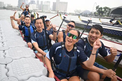 Health Minister Ong Ye Kung (second row, left) paddling in the opening race of the IHH Healthcare x Singapore Sea Regatta on Sept 13.