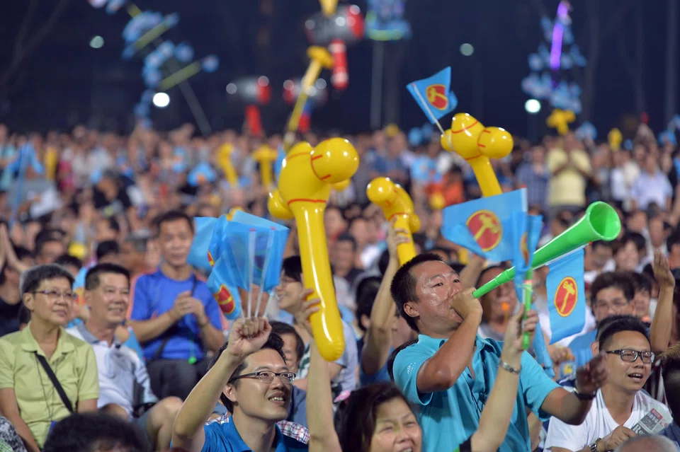 A supporter blowing a vuvuzela at a Workers' Party's rally at Yishun Stadium in 2015.