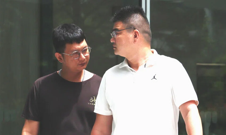 YY E-bike store manager Chu Foo Siang (left) and director Zhang Meng were handed one charge each of providing illegal modification services on a PMD.