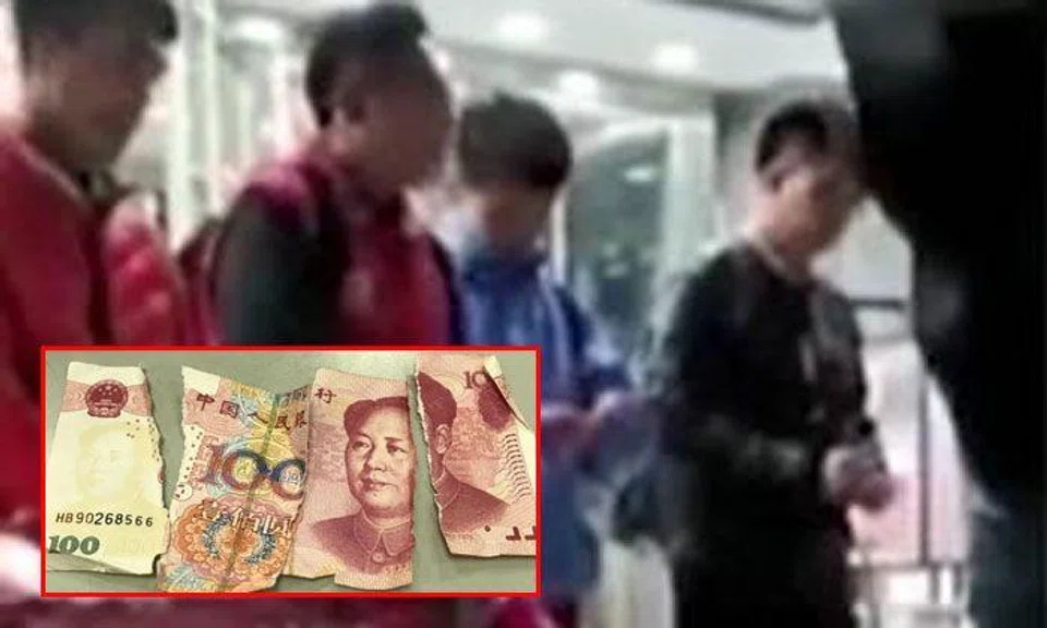 Manager in China tries to motivate staff by making them tear up banknotes