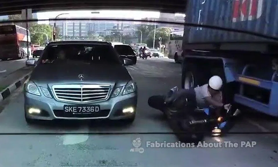 Merc driver knocks motorcyclist off bike, causing him to hit wheel of moving trailer truck