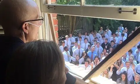 The reason why 400 students turned up on their teacher's lawn will make