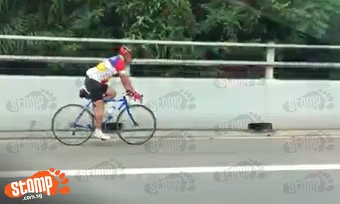 How about NOT cycling on the expressway so that you don't endanger yourself or others?