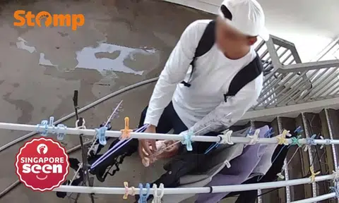 man takes women's underwear at Yishun HDB block