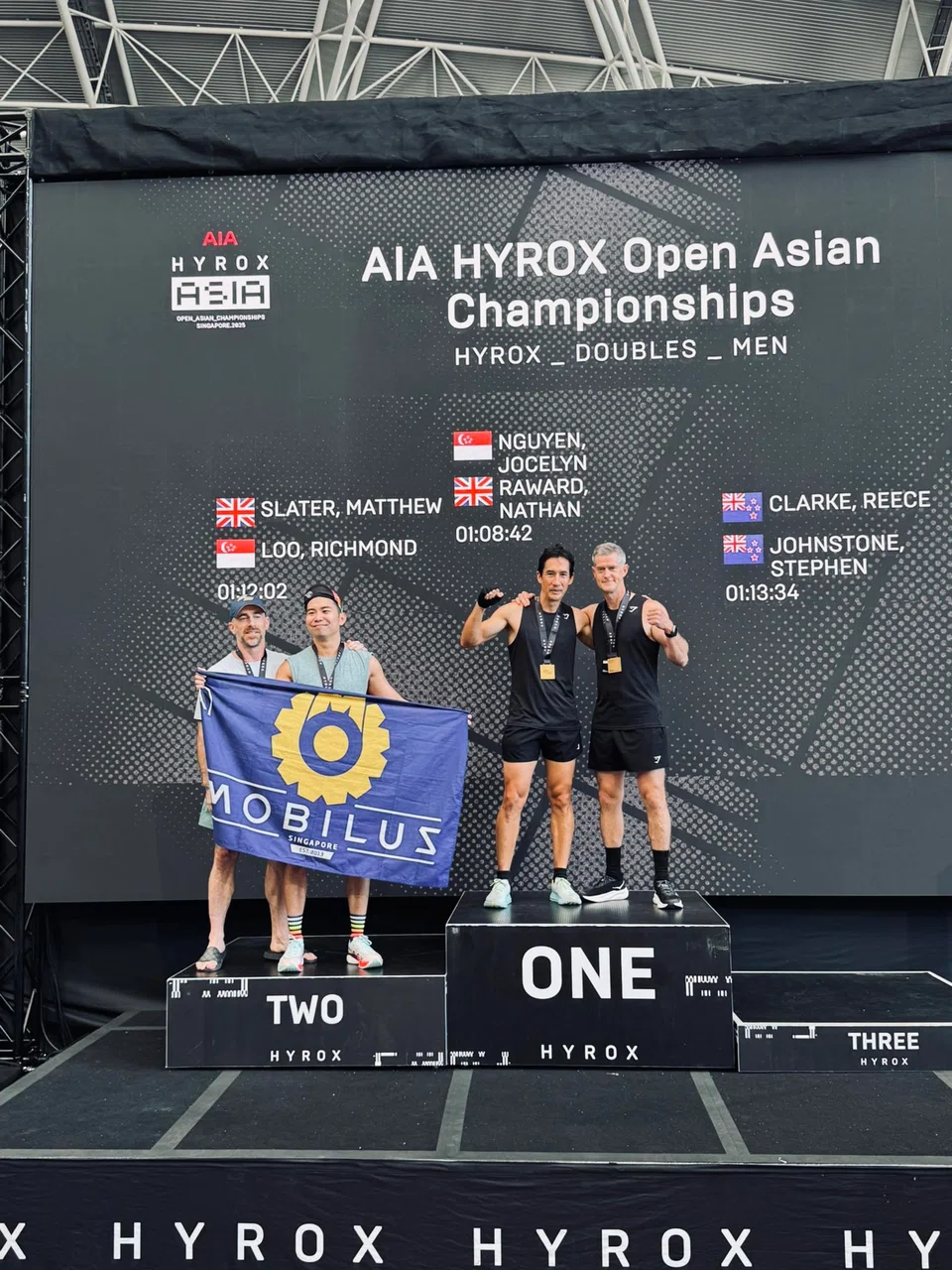 Mr Richmond Loo (second from left) and Mr Matthew Slater (far left) came in second in the 45-to-49 age group at the AIA Hyrox Open Asian Championships in June.