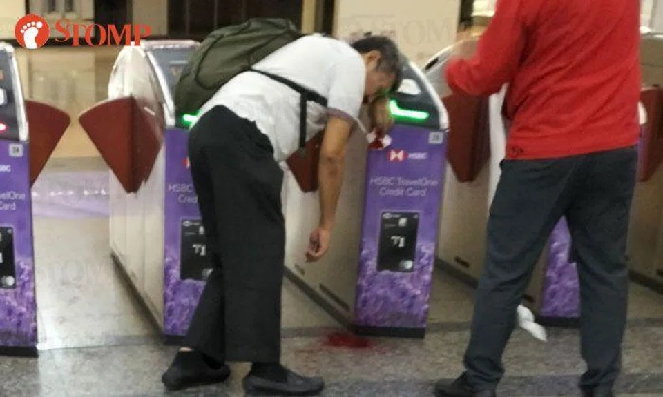 Two men arrested after fight at Orchard MRT Station, one seen bleeding from nose