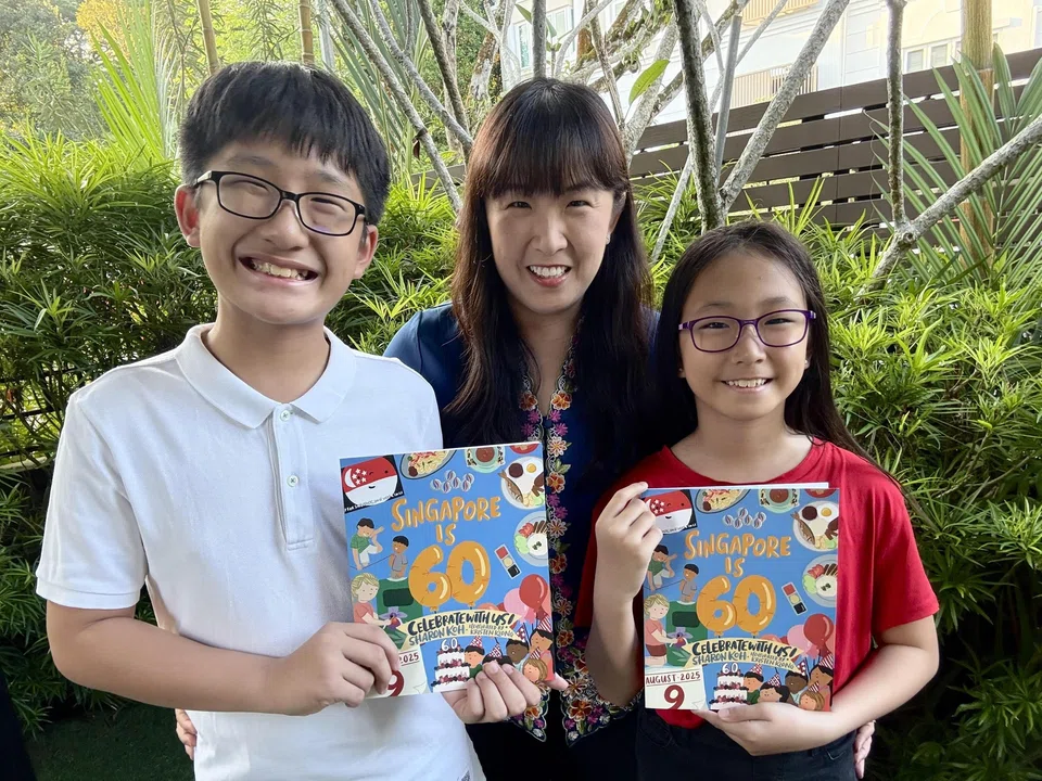 Sharon Koh, seen here with her children, authored Singapore Is 60: Celebrate With Us! to commemorate the country’s birthday and also raise funds for the President's Challenge.