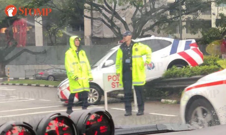 A police car was seen on the road divider along Kampong Road yesterday. (Jan 26)