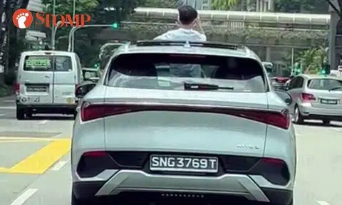 By standing in the BYD Atto electric SUV with his body sticking out of the sunroof, the boy in the video is clearly not wearing a seatbelt.