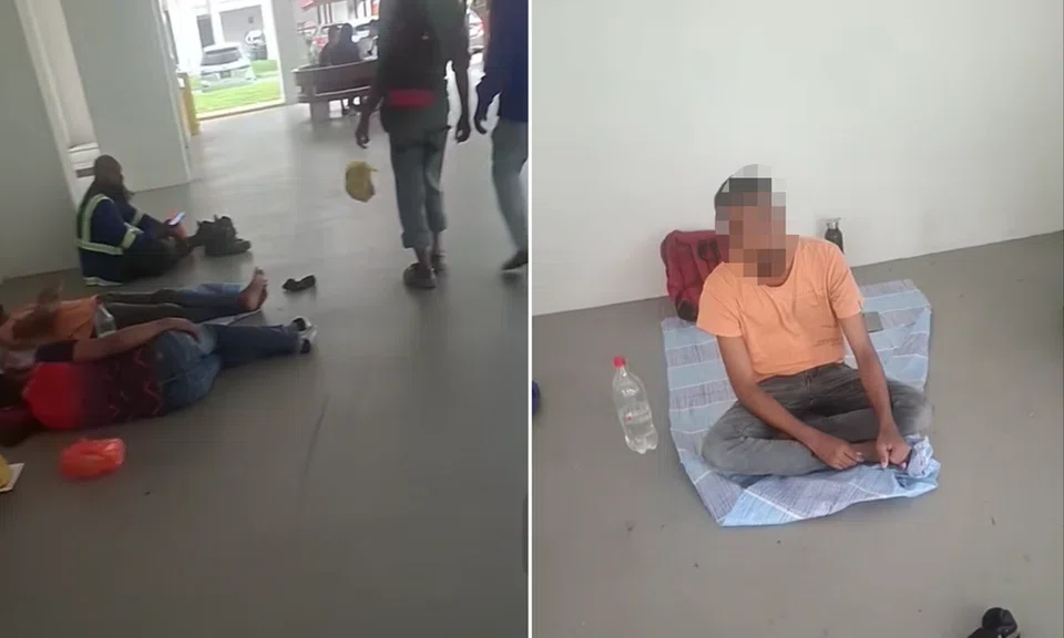 The workers sat cross-legged on the floor in silence.