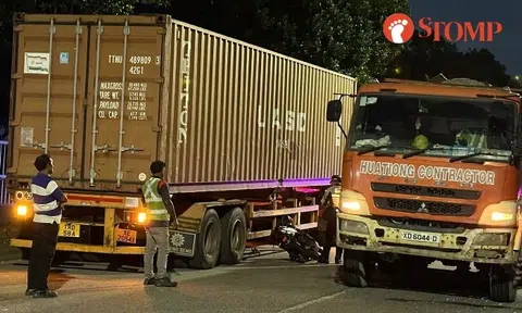 Motorcyclist taken to hospital after accident with trailer and tipper truck at Pandan Road