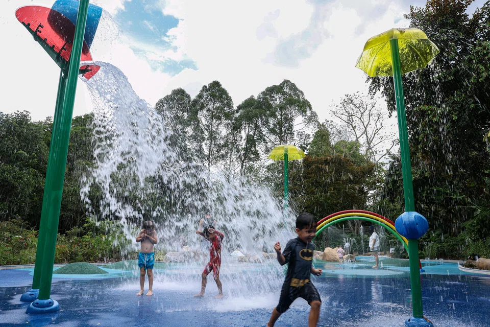 The refreshed Waterplay space at Jacob Ballas Children's Garden has features such as umbrella fountains and a splash bucket simulate rain.