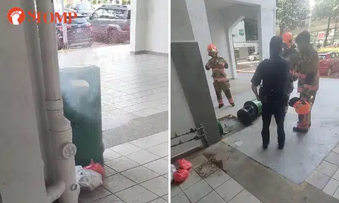Member of public uses buckets of water to put out bin fire at Geylang East