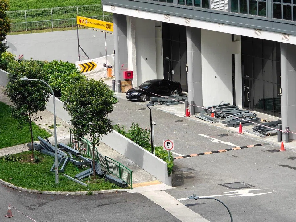 The metal debris was moved off the road after falling from an external structure at Inspace at 24 New Industrial Road.