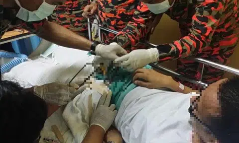 Firemen working hard to cut off a penis ring in last year's case. Photo: The Star