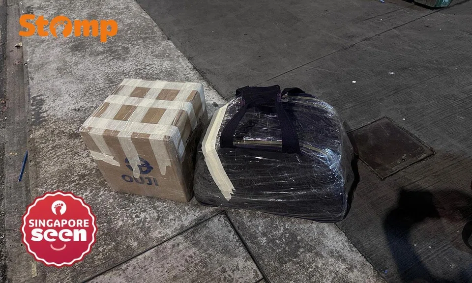 gojek driver cancels ride after seeing woman's duffel bag and box