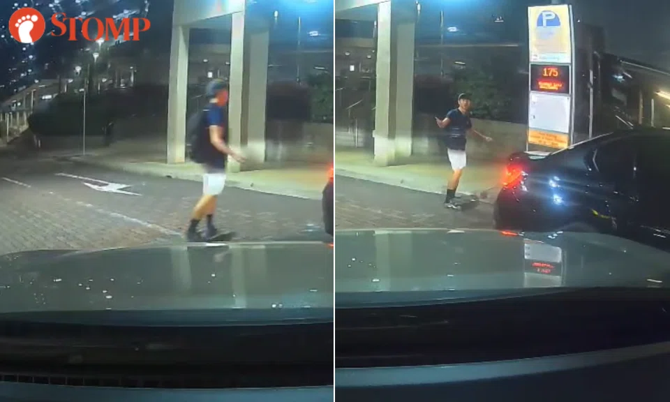 Youth on skateboard darts in front of car in Ghim Moh, turns back to 'challenge' driver