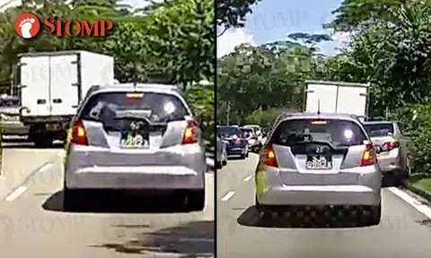 Lorry driver flees after colliding into car, sends it crashing up road divider on Lentor Ave