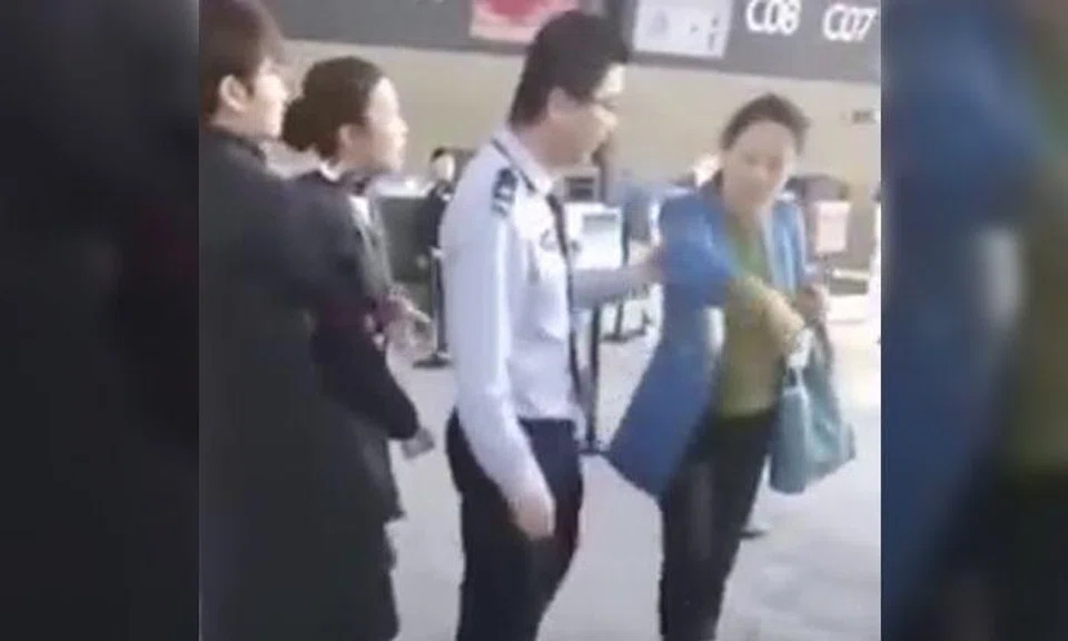 Chinese 'professor' threatens to slap airline staff after being late and missing flight