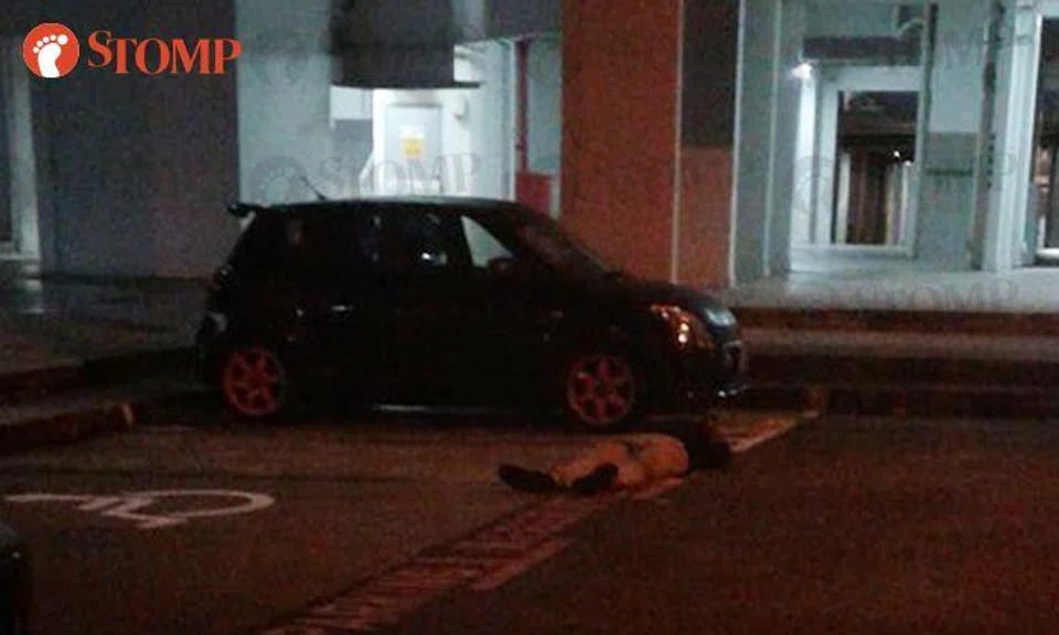 Man lies down in the middle of Jurong West carpark -- at 5.30am