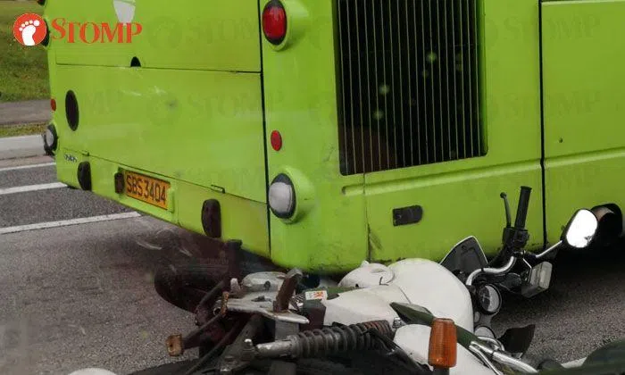 Rider, 22, taken to hospital after his motorcycle ends up under bus in ...
