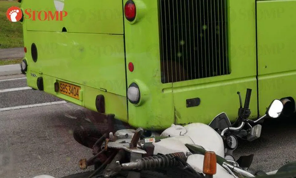 Rider, 22, taken to hospital after his motorcycle ends up under bus in ...
