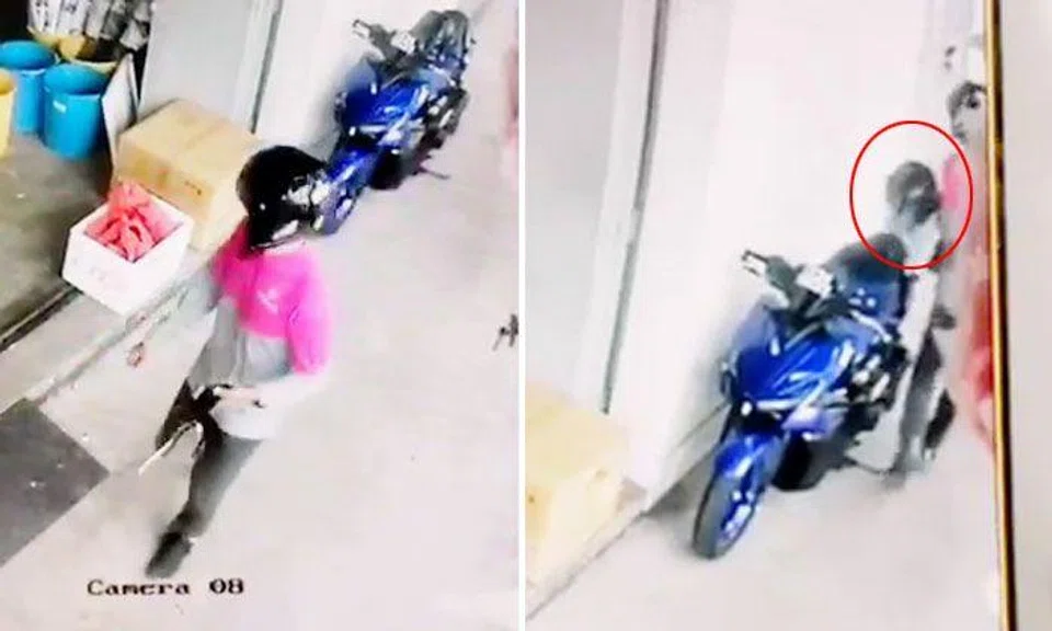 Foodpanda delivery guy takes other rider's helmet from bike at Defu Lane 10