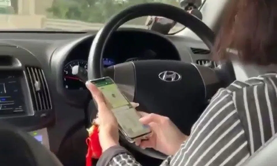 Private-hire driver caught holding phone with both hands and texting while driving